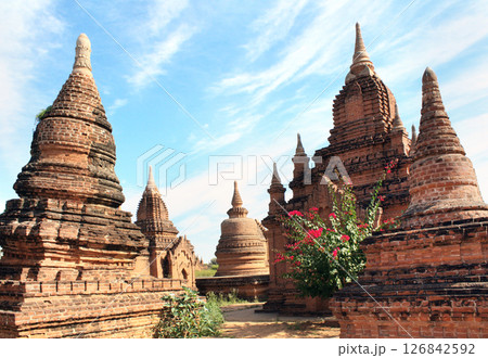 Famous tourist landmark of Bagan, Myanmar. Ancient stupas in archaeological zone, Bagan, Burma. Topic of vacation, travel, trip abroad on vacation, cruises and tours Famous tourist landmark of Bagan, Myanmar. Ancient stupas in archaeological zone, Bagan, Burma. Topic of vacation, travel, trip abroad on vacation, cruises and tours 126842592