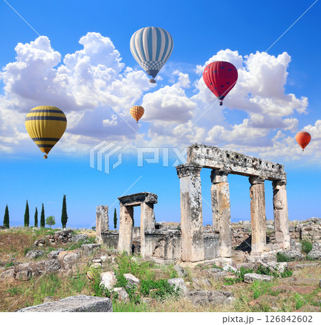 Air balloons and ancient building on Frontinus street, Hierapolis, Pamukkale, Turkey. Topic of vacation, travel, trip abroad, cruises and tours. Balloon flight, famous tourist attraction of Pamukkale Air balloons and ancient building on Frontinus street, Hierapolis, Pamukkale, Turkey. Topic of vacation, travel, trip abroad, cruises and tours. Balloon flight, famous tourist attraction of Pamukkale 126842602