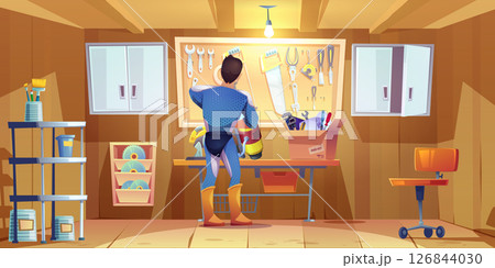 Superhero man works in garage workshop Superhero man works in garage workshop 126844030