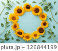 鮮やかなブルーの背景にひまわりの花束。父の日のイメージ。感謝の気持ちを表す。 126844199