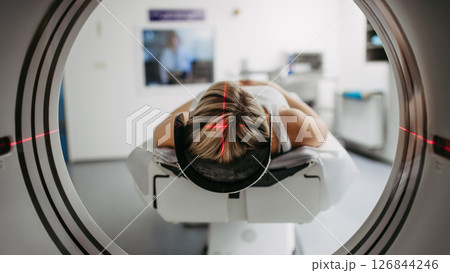 CT scanner view of patient during medical imaging procedure. CT scanner view of patient during medical imaging procedure. 126844246