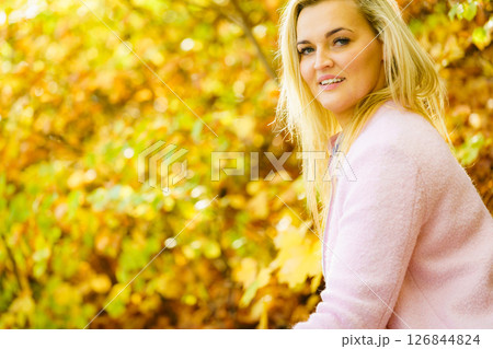 Blonde woman relaxing in autumn park 126844824