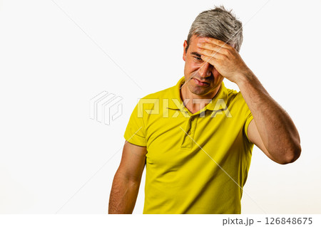 Man showing frustration in a simple studio setting Man showing frustration in a simple studio setting 126848675