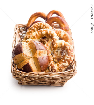 Salted bavarian pretzels and buns isolated on white background. 126849233