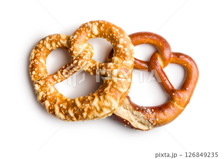 Salted bavarian pretzel isolated on white background. Salted bavarian pretzel isolated on white background. 126849235