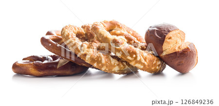 Salted bavarian pretzels and buns isolated on white background. Salted bavarian pretzels and buns isolated on white background. 126849236