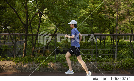 Outdoor Running Routine on a Sunny Day. Running Motivation. Start Your Fitness Journey. 126850754