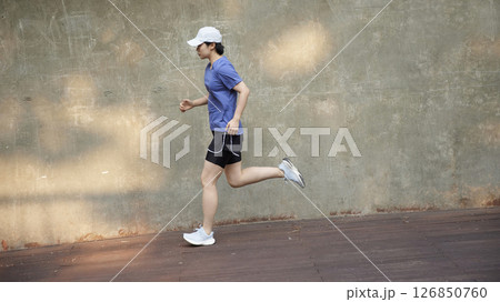 Outdoor Running Routine on a Sunny Day. Running Motivation. Start Your Fitness Journey. 126850760