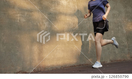 Outdoor Running Routine on a Sunny Day. Running Motivation. Start Your Fitness Journey. Outdoor Running Routine on a Sunny Day. Running Motivation. Start Your Fitness Journey. 126850790