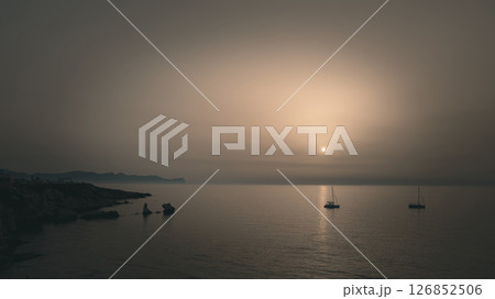 Beautiful sunset over the coasts of Sicily, with stunning colors 126852506
