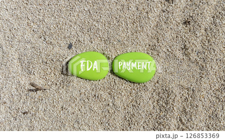FDA Food and Drug Administration payment symbol. Concept words FDA payment on beautiful green stone. Beautiful sand beach background. Business FDA payment concept. Copy space. FDA Food and Drug Administration payment symbol. Concept words FDA payment on beautiful green stone. Beautiful sand beach background. Business FDA payment concept. Copy space. 126853369