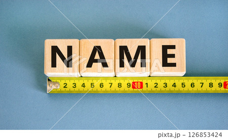 Name symbol. Concept word Name on beautiful wooden blocks. Beautiful yellow ruler. Beautiful blue table blue background. Business, lifestyle, support and name concept. Copy space. Name symbol. Concept word Name on beautiful wooden blocks. Beautiful yellow ruler. Beautiful blue table blue background. Business, lifestyle, support and name concept. Copy space. 126853424