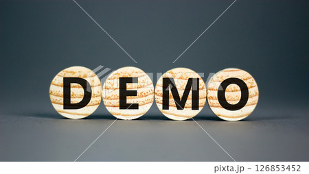 Demo symbol. Concept word Demo on beautiful wooden circles. Beautiful grey table grey background. Business and demo concept. Copy space. 126853452