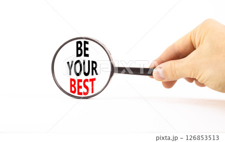 Motivational be your best symbol. Concept words Be your best on beautiful black magnifying glass. Beautiful white background. Businessman hand. Business motivational be your best concept. Copy space. Motivational be your best symbol. Concept words Be your best on beautiful black magnifying glass. Beautiful white background. Businessman hand. Business motivational be your best concept. Copy space. 126853513