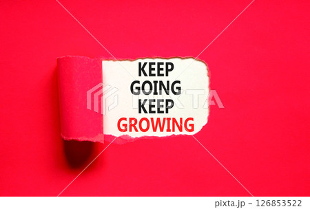 Keep going and growing symbol. Concept words phrase Keep going keep growing on beautiful white paper. Beautiful red paper background. Business Keep going and growing concept. Copy space. 126853522