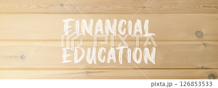 Financial education symbol. Concept words Financial education on beautiful wooden wall. Beautiful wooden wall background. Business Financial education concept. Copy space. 126853533