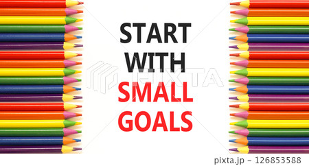 Start with small goals symbol. Concept words phrase Start with small goals on beautiful paper. Colored pencils. Beautiful white paper background. Business Start with small goals concept. Copy space. 126853588