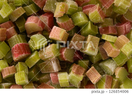 Freshly peeled chopped rhubarb stalks ready for culinary adventures in kitchen. Frozen food. Save for cooking later. Food pattern. Freshly peeled chopped rhubarb stalks ready for culinary adventures in kitchen. Frozen food. Save for cooking later. Food pattern. 126854006
