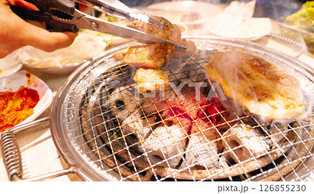 Preparing Traditional Korean Barbecue Grill Pork. 126855230