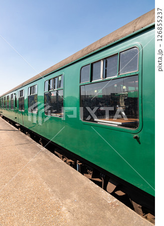 The empty passenger green railway carriages at Tunbridge Wells railway station. 126855237