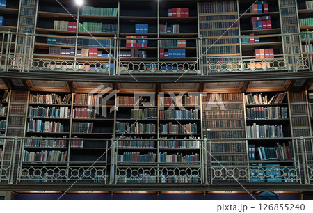 Book stack on wooden shelves inside The Reading Room situated in the centre of the Great Court of the British Museum. 126855240