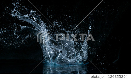 Clear water splash on a black background , close-up Clear water splash on a black background , close-up 126855294
