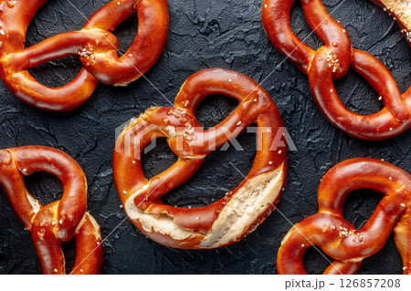 Pretzel or Bretzel, traditional German beer snack, a wheat bread with salt Pretzel or Bretzel, traditional German beer snack, a wheat bread with salt 126857208