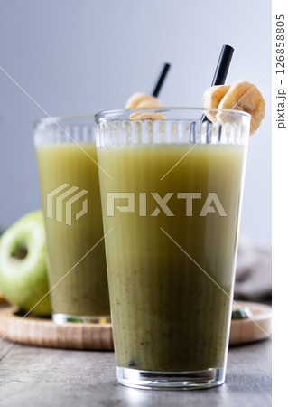 Green smoothie with spinach,banana, apple, and lemon on wooden tablespace Green smoothie with spinach,banana, apple, and lemon on wooden tablespace 126858805