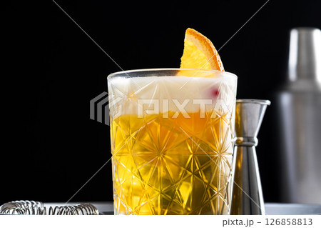 Classic cocktail whiskey sour on black background Classic cocktail whiskey sour on black background 126858813