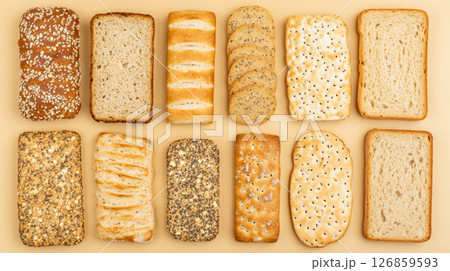 An assortment of diet breads including seed loaf on beige background An assortment of diet breads including seed loaf on beige background 126859593