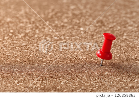 Single Red Pushpin on Empty Cork Board as a Symbol of Waiting or Anticipation 126859863