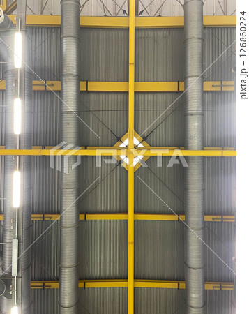 Construction details inside industrial roofs 126860224