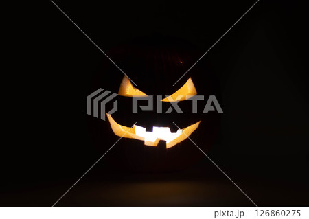 one halloween pumpkin backlit background one halloween pumpkin backlit background 126860275