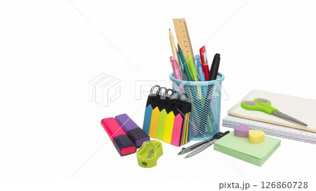 School and office supplies, pens, pencils, ruler, compass in a metal cup on a white background. 126860728