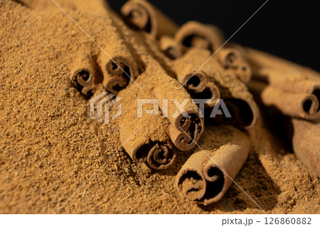 Cassia Cinnamon Sticks and Ground Spice Close-Up 126860882