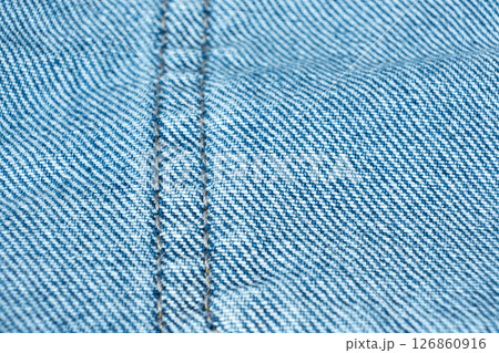 Detailed View of Blue Jeans Fabric and Thread Stitching 126860916