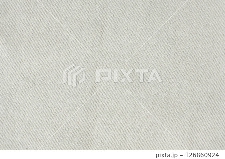 Macro texture of a fabric consisting of one hundred percent cotton. Macro texture of a fabric consisting of one hundred percent cotton. 126860924
