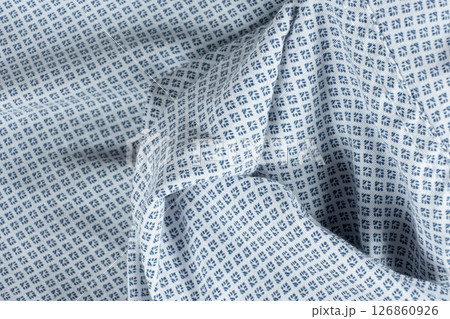 Macro texture of a fabric consisting of one hundred percent cotton. Macro texture of a fabric consisting of one hundred percent cotton. 126860926