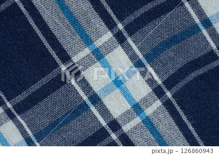 Macro texture of a fabric consisting of one hundred percent cotton. Macro texture of a fabric consisting of one hundred percent cotton. 126860943