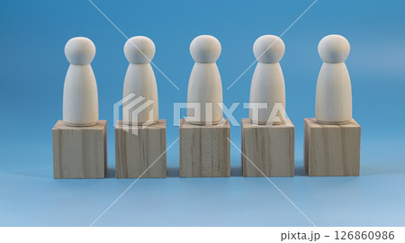 Wooden human model placed on wooden blocks Wooden human model placed on wooden blocks 126860986
