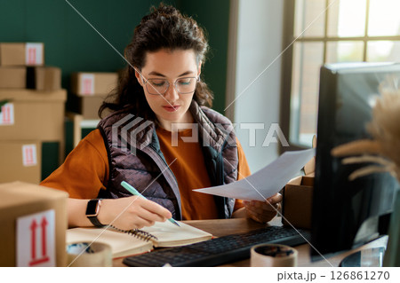 Woman working in a warehouse Woman working in a warehouse 126861270