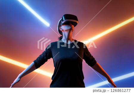 Woman with VR virtual reality goggles 126861277