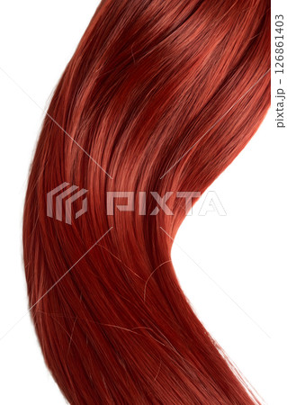 Close-up of a single fiery red hair strand detailed texture, warm tones, beauty and genetics concept 126861403