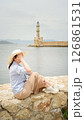 Tourist enjoying view of chania lighthouse in crete, greece 126861531