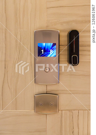 Modern elevator control panel with digital display and button interface 126861967