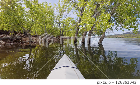 spring kayaking or canoeing on Horsetooth Reservoir at foothills of Rocky Mountains near Fort Collins, Colorado - POV paddler perspective spring kayaking or canoeing on Horsetooth Reservoir at foothills of Rocky Mountains near Fort Collins, Colorado - POV paddler perspective 126862042