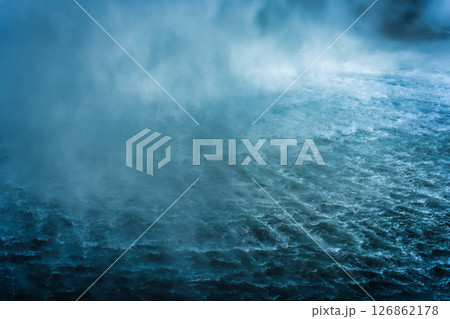 Powerful moody waterfall flowing in tropical rainforest 126862178