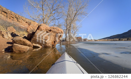 winter kayaking or canoeing on Horsetooth Reservoir near Fort Collins, Colorado - POV paddler perspective 126862244