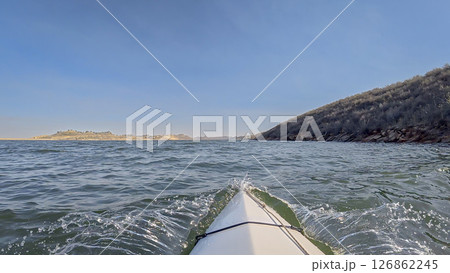 winter kayaking or canoeing on Horsetooth Reservoir near Fort Collins, Colorado - POV paddler perspective 126862245