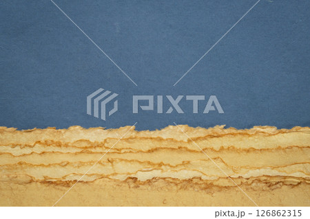 abstract desert landscape created with sheets of textured colorful handmade paper abstract desert landscape created with sheets of textured colorful handmade paper 126862315